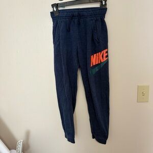 Nike Kids Blue Joggers with Orange Logo